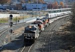 NS 9948 leads train O56 past train P080-28 in the station